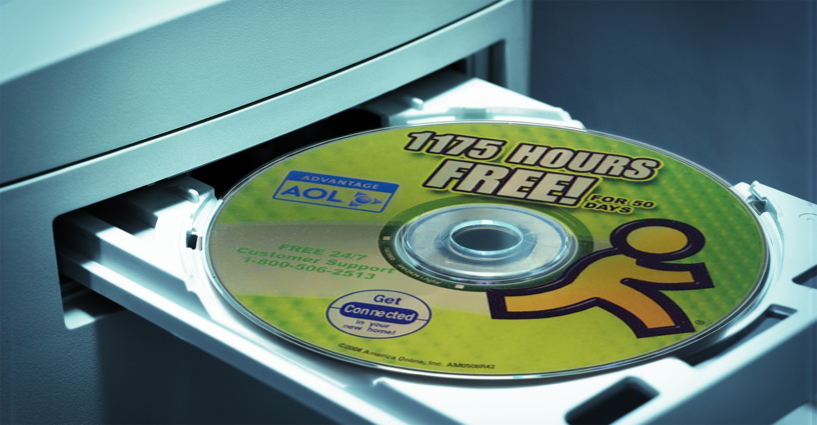 Close-up of an AOL free trial CD-ROM being inserted into a disc drive
